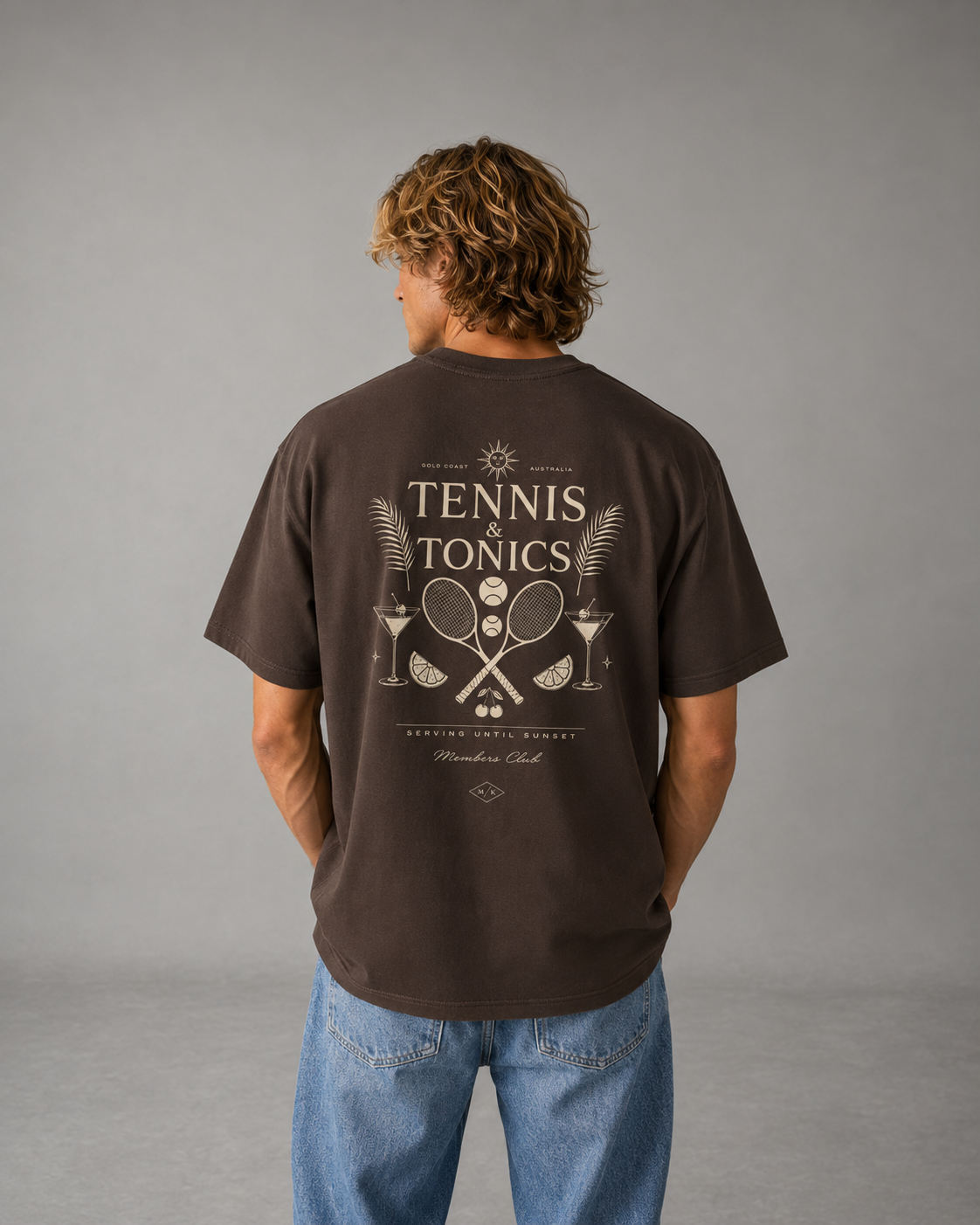 Blonde male model wears Meek "Tennis & Tonics" Shirt facing away from camera